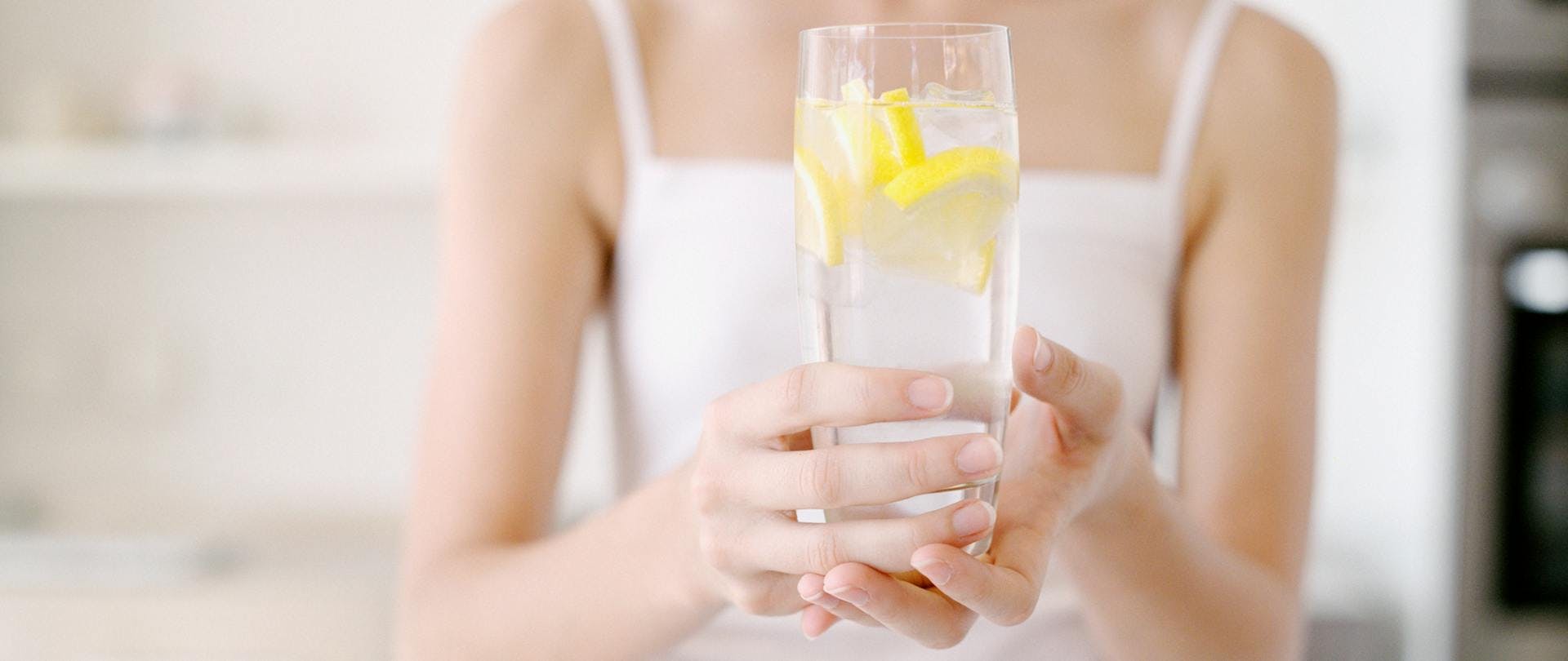 Arsenic Poisoning Health Concerns and Dangers Woman Enjoys a Glass of Water