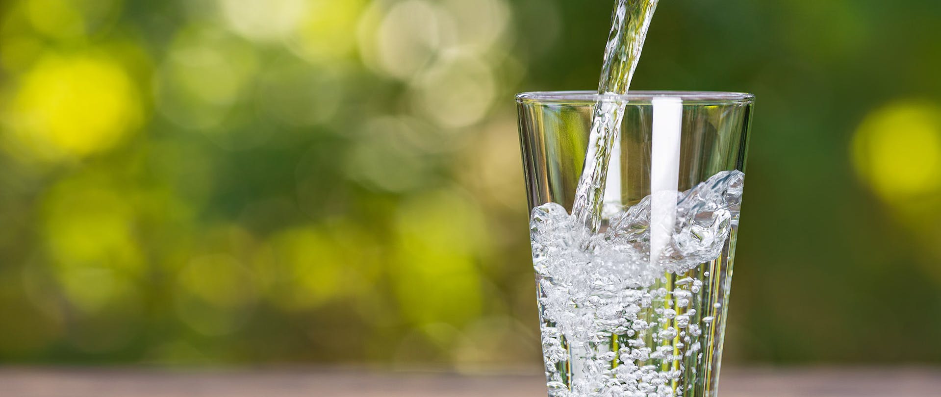 Filtered Water Being Poured Health Benefits to Drinking