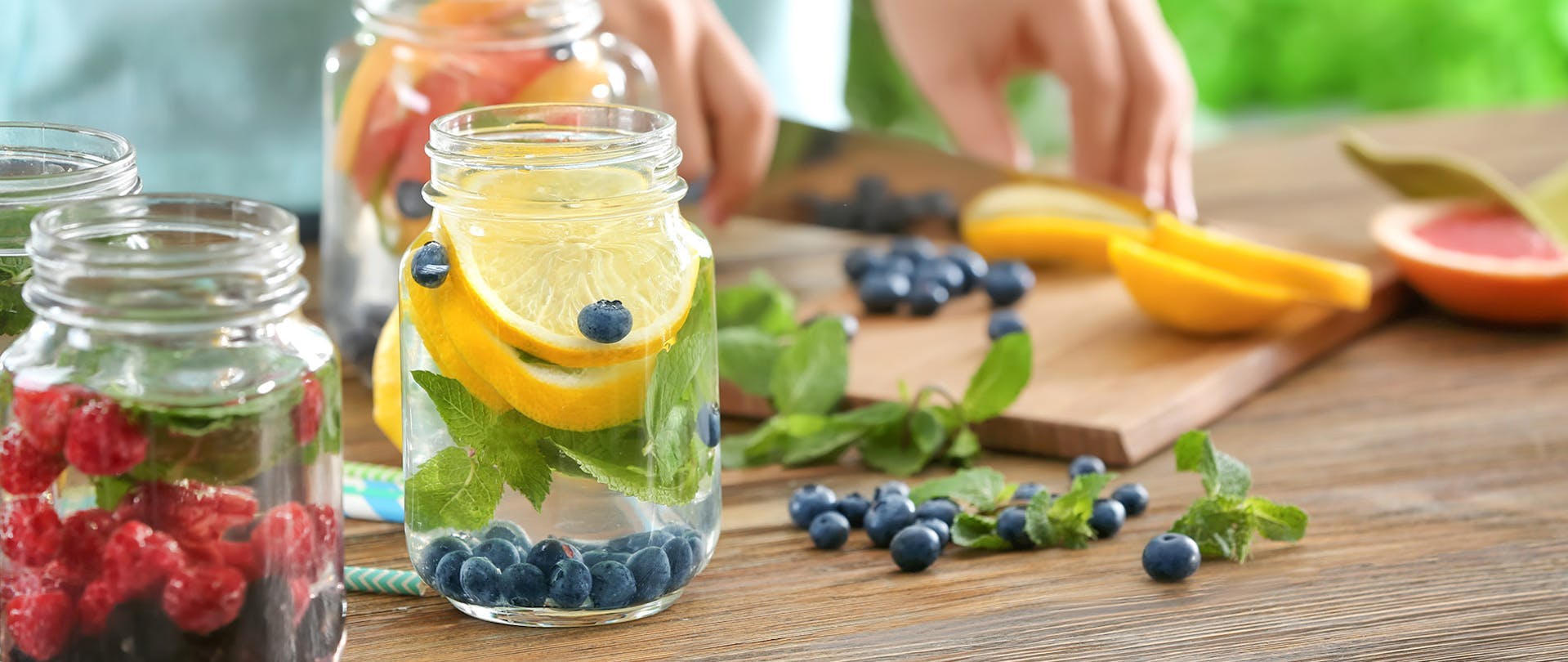 Infused Water Recipes Woman Cuts Fruits