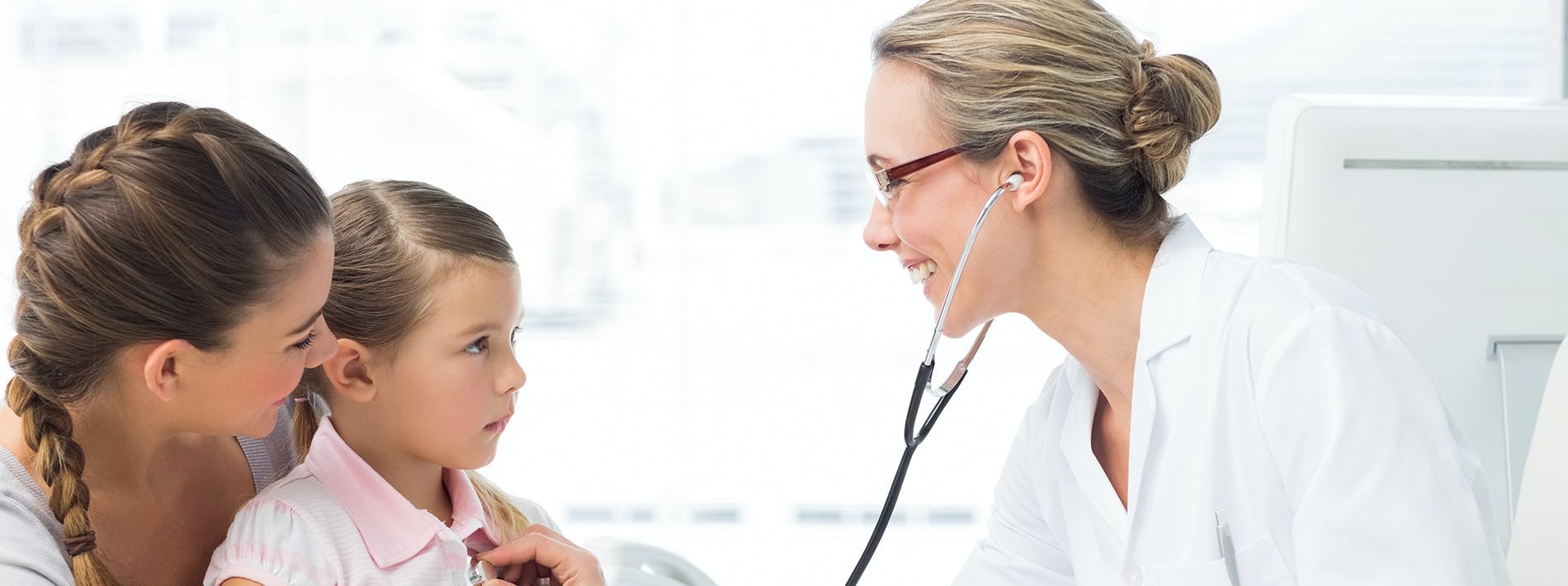 Doctor Checks Young Patient for Illness