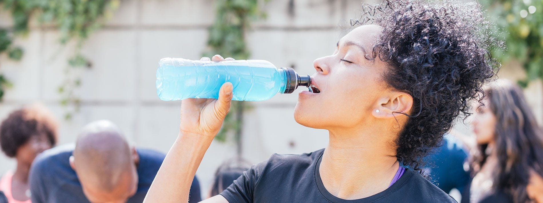 Woman Avoids Dehydration with Bottle of Water